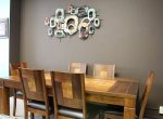 Wall decor above a 7 piece dining room set